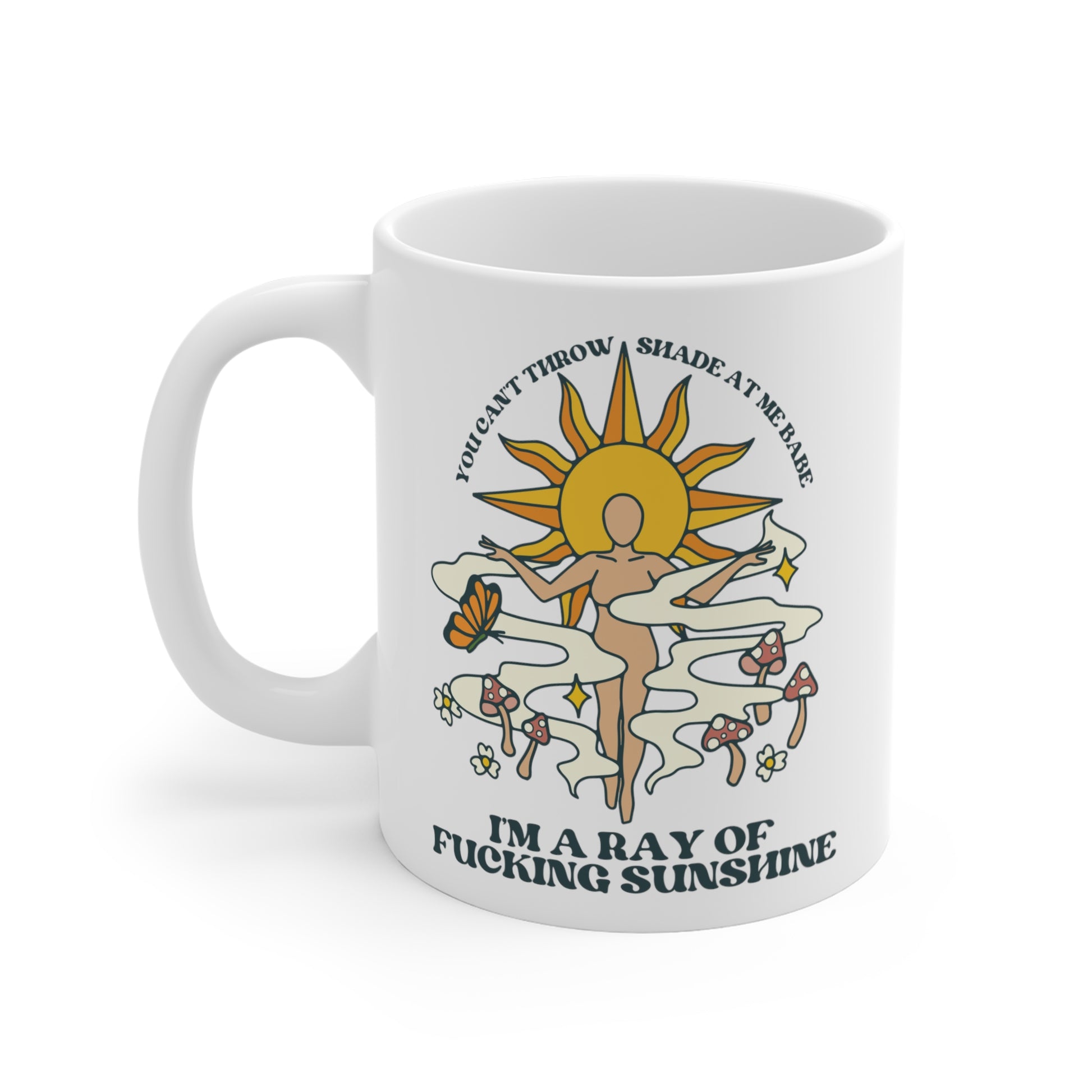 A white ceramic mug that says You Can't Throw Shade At Me, I'm a Ray of Fucking Sunshine.