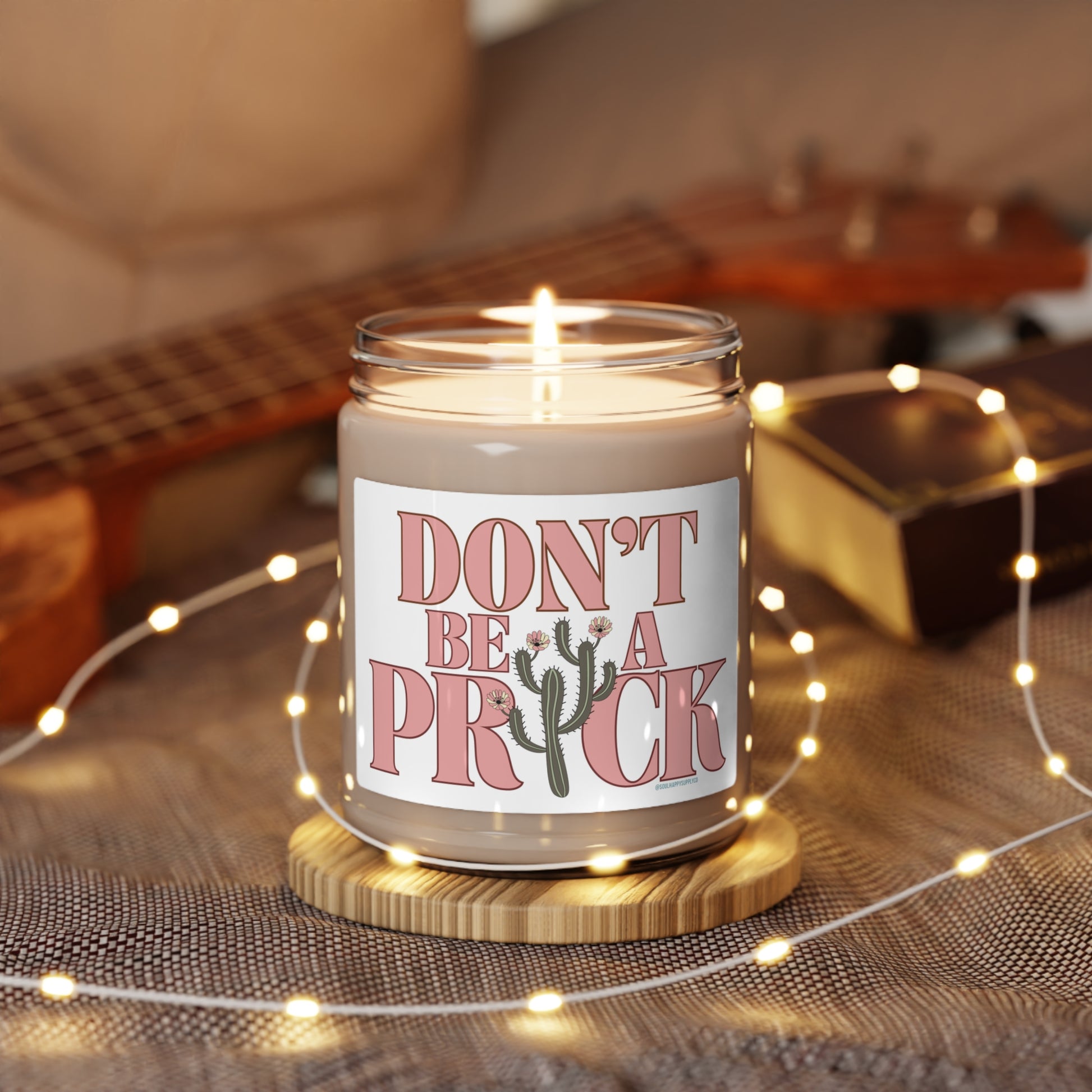 Eco friendly, 9oz soy wax candle with cotton wick and "Don't Be A Prick" design.