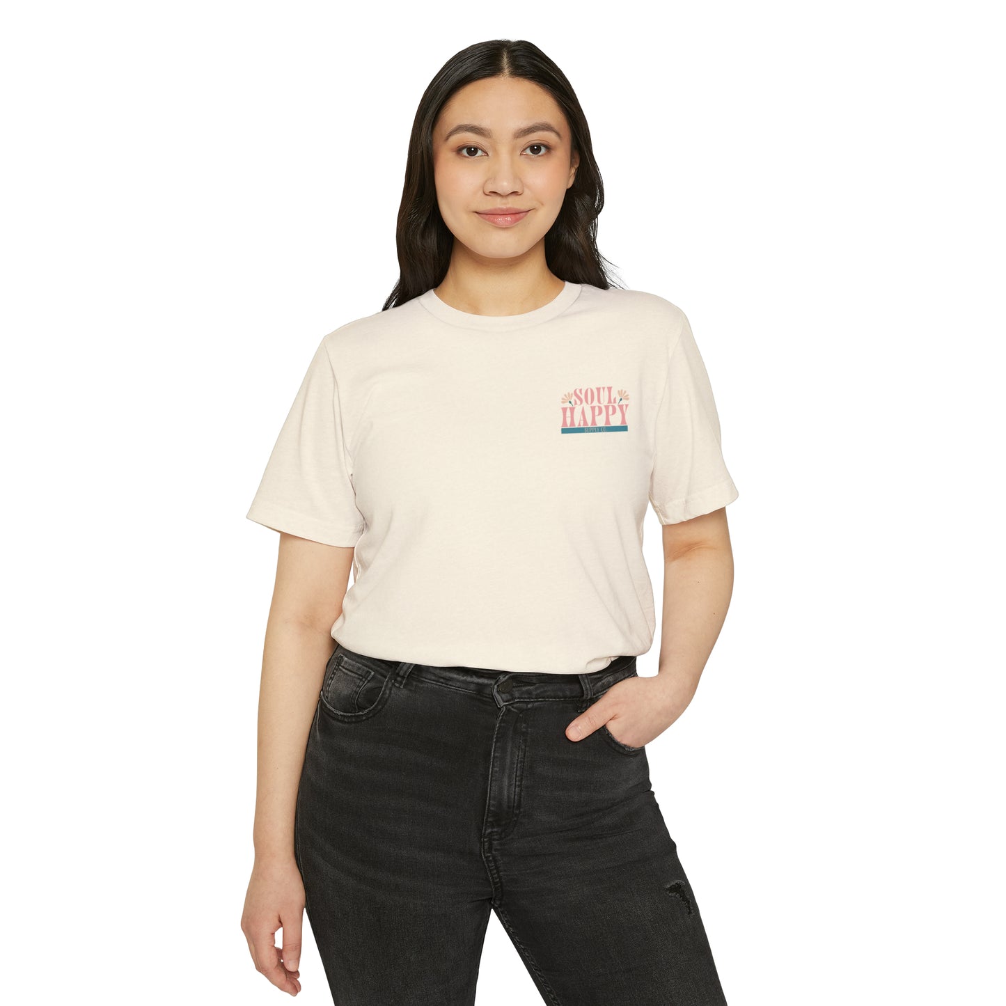 Woman wearing a natural beige recycled, organic, short sleeved t-shirt that says Soul Happy Supply Co. on the front.