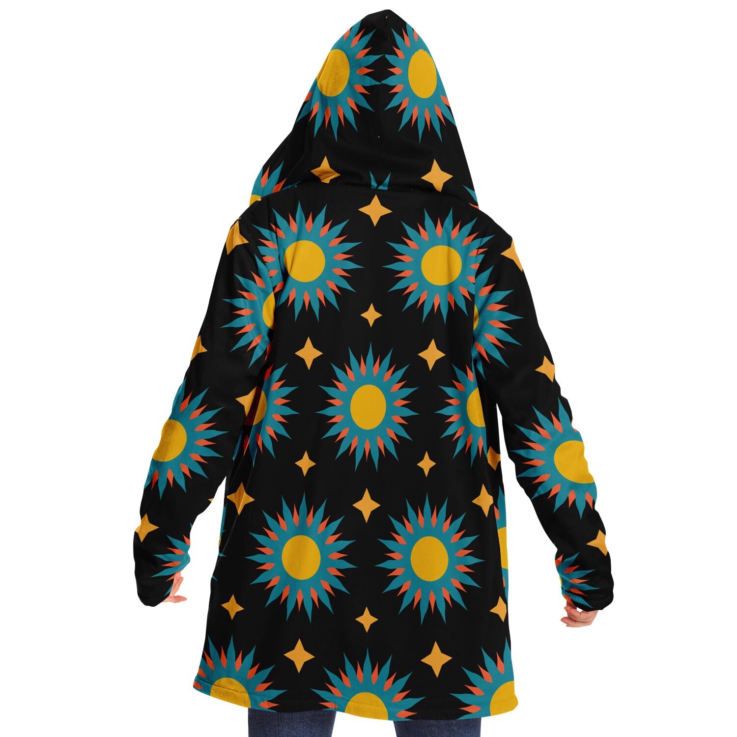 Woman wearing a cozy, hooded, black microfleece cloak with a colorful sun design.