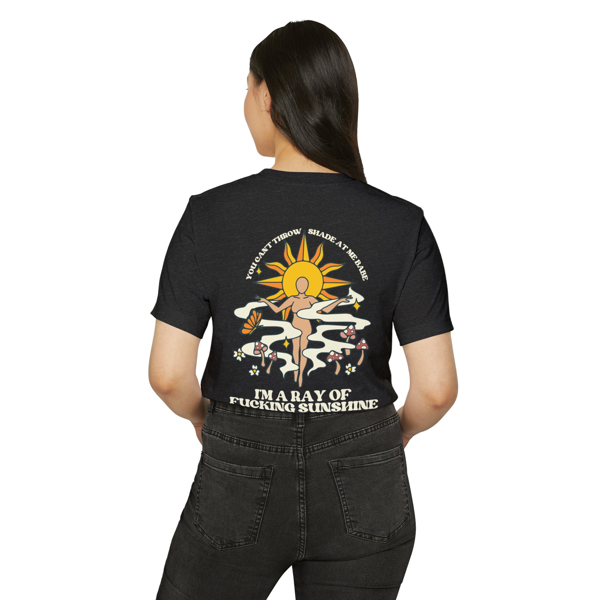 Woman wearing a dark grey recycled, organic, short sleeved t-shirt that says You Can't Throw Shade at Me Babe, I'm a Ray of Fucking Sunshine on the back.