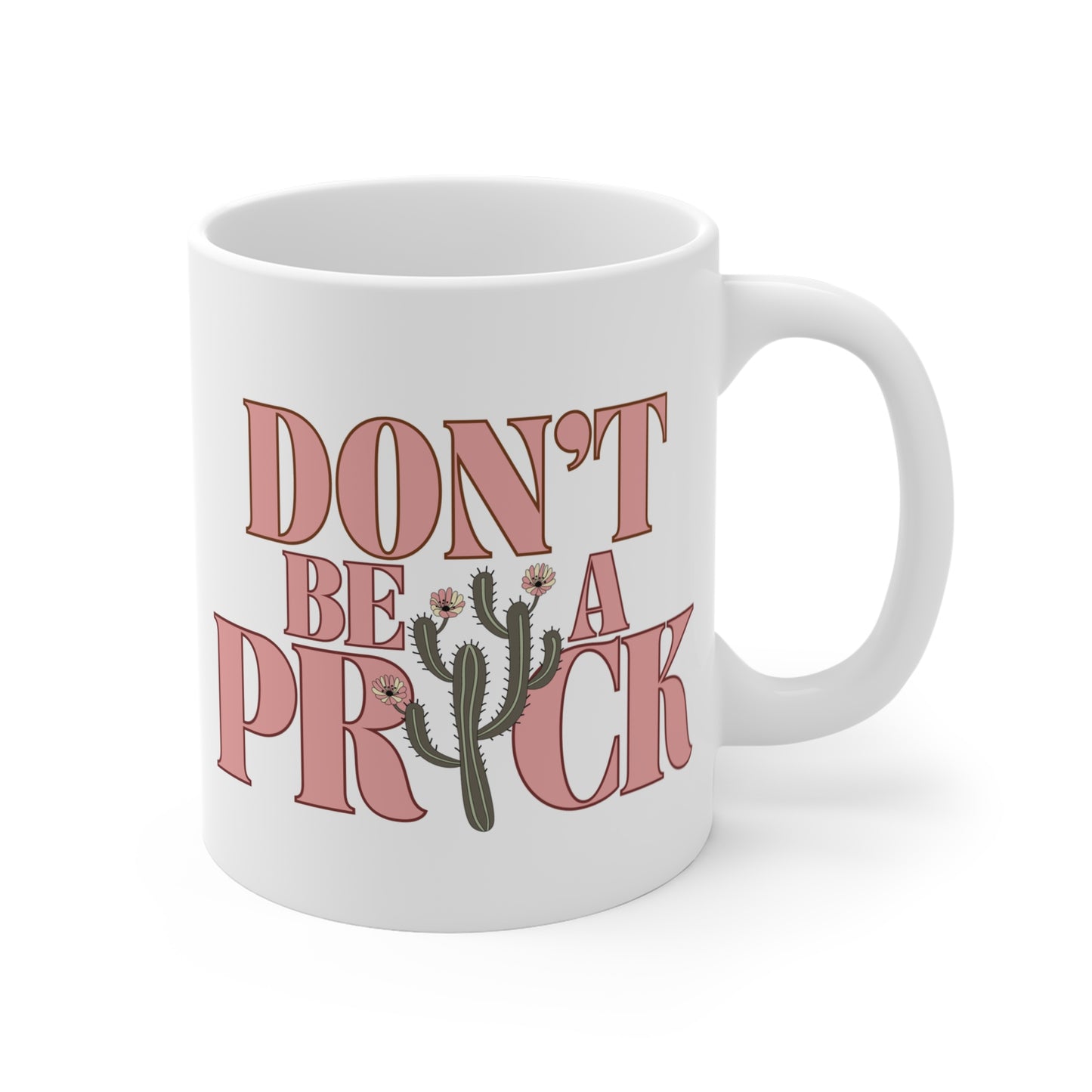 A white ceramic mug that says Don't Be A Prick.