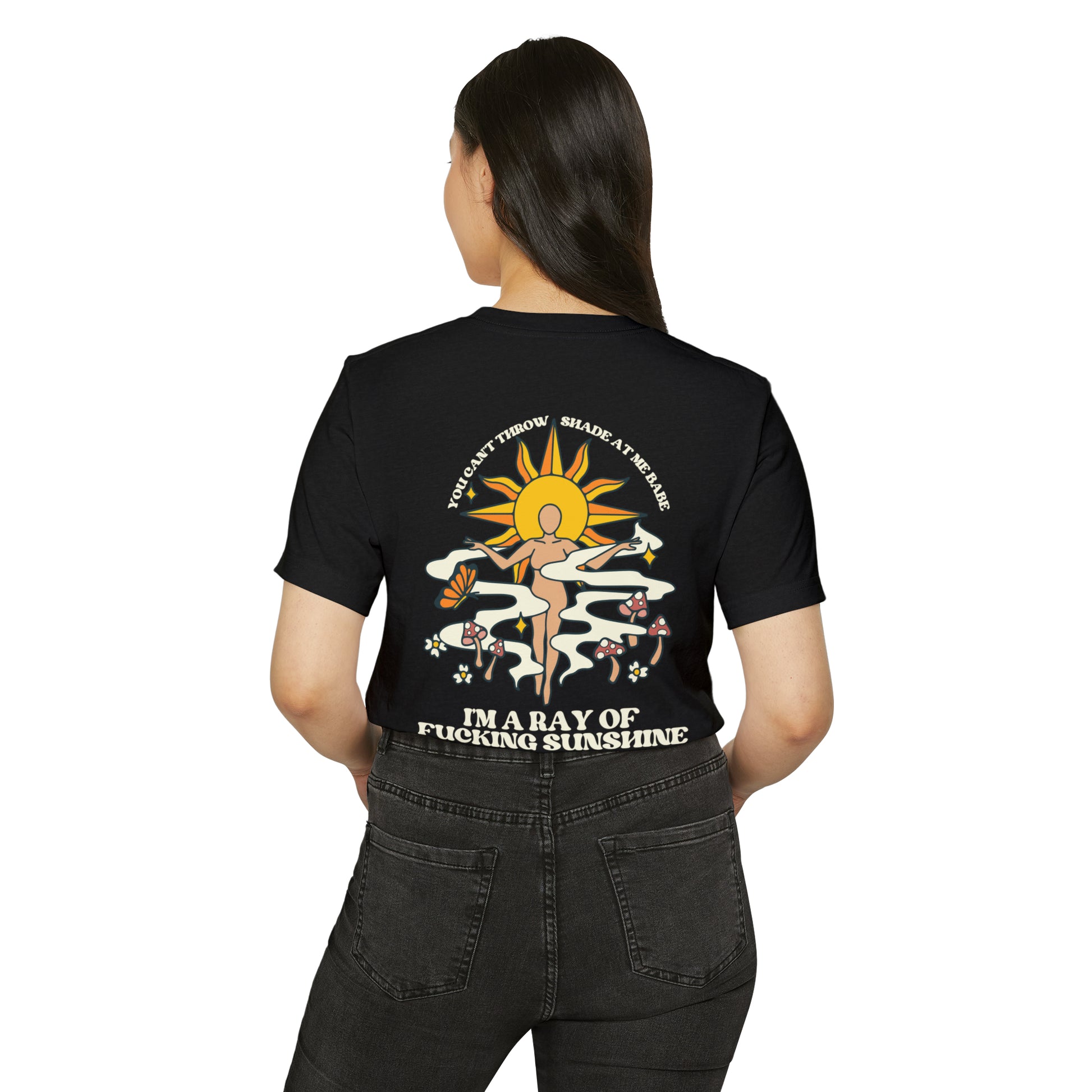 Woman wearing a black recycled, organic, short sleeved t-shirt that says You Can't Throw Shade at Me Babe, I'm a Ray of Fucking Sunshine on the back.