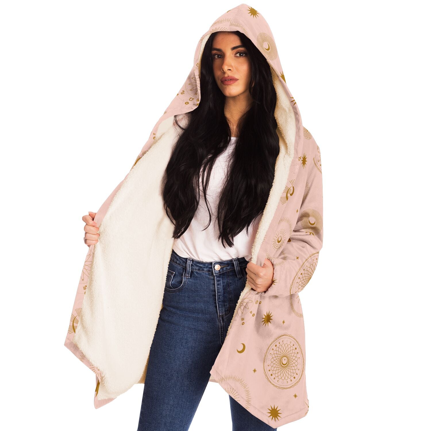 Woman wearing a cozy, hooded, light pink microfleece cloak with gold cosmic zodiac design
