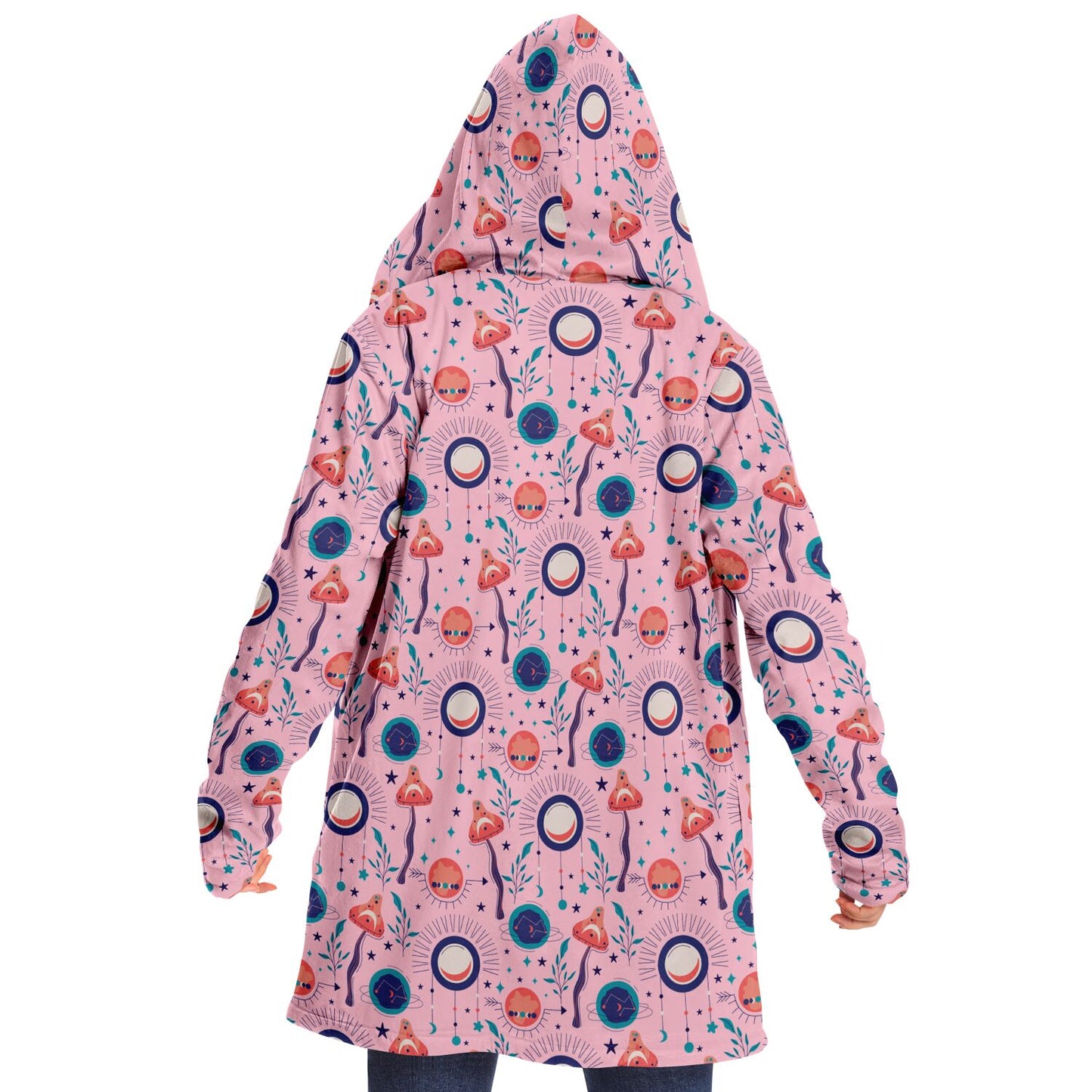 Woman wearing a cozy, hooded, pink microfleece cloak with a colorful, trippy mushroom design.