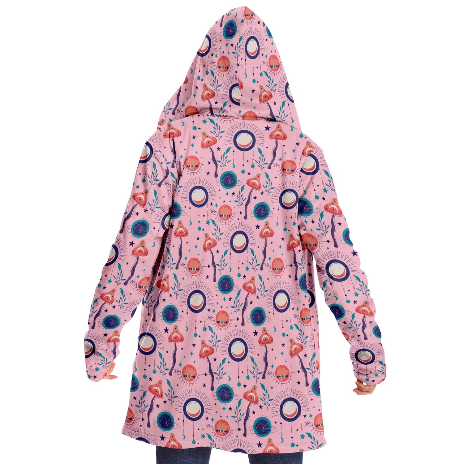 Woman wearing a cozy, hooded, pink microfleece cloak with a colorful, trippy mushroom design.