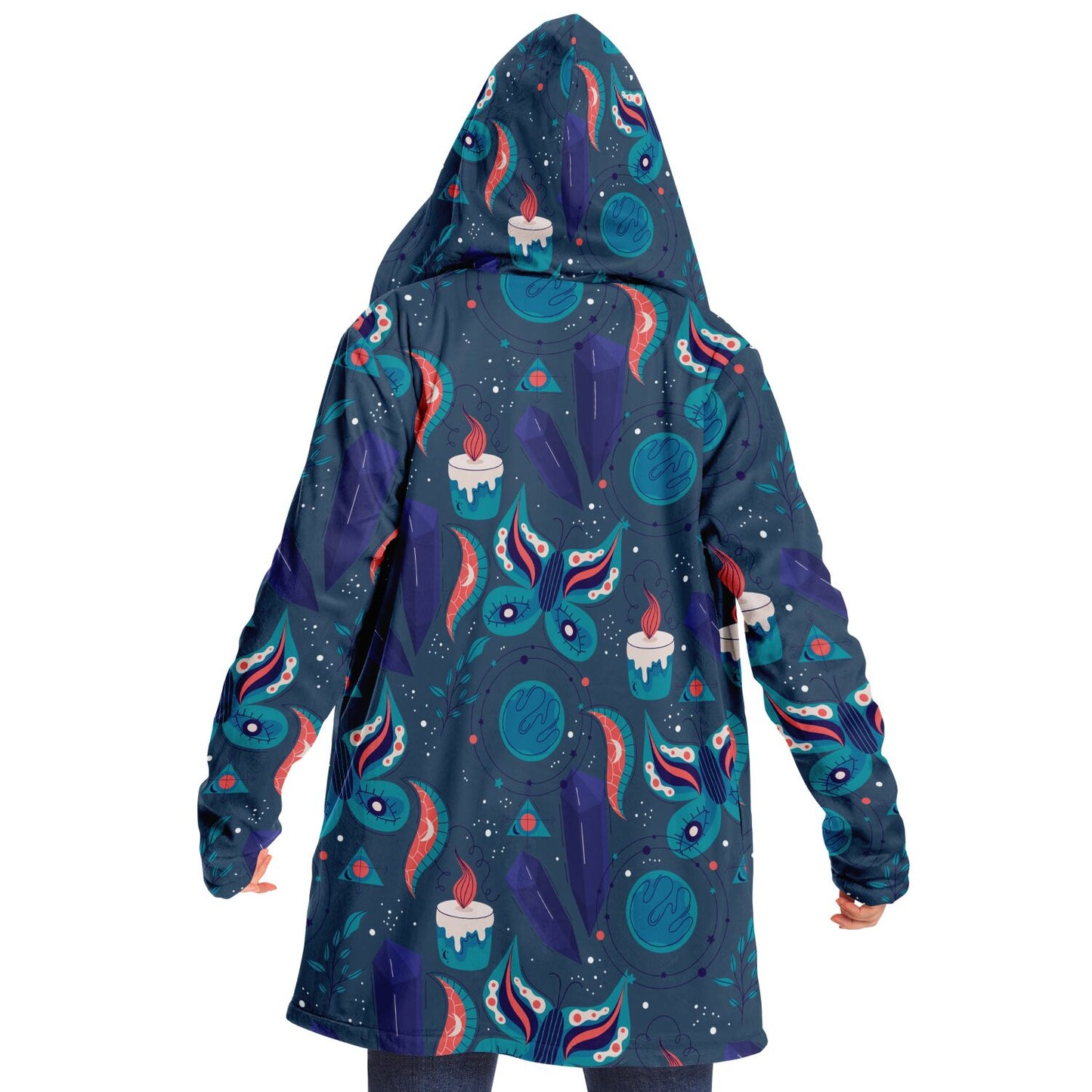 Woman wearing a cozy, hooded, blue microfleece cloak with a colorful butterfly and candle design