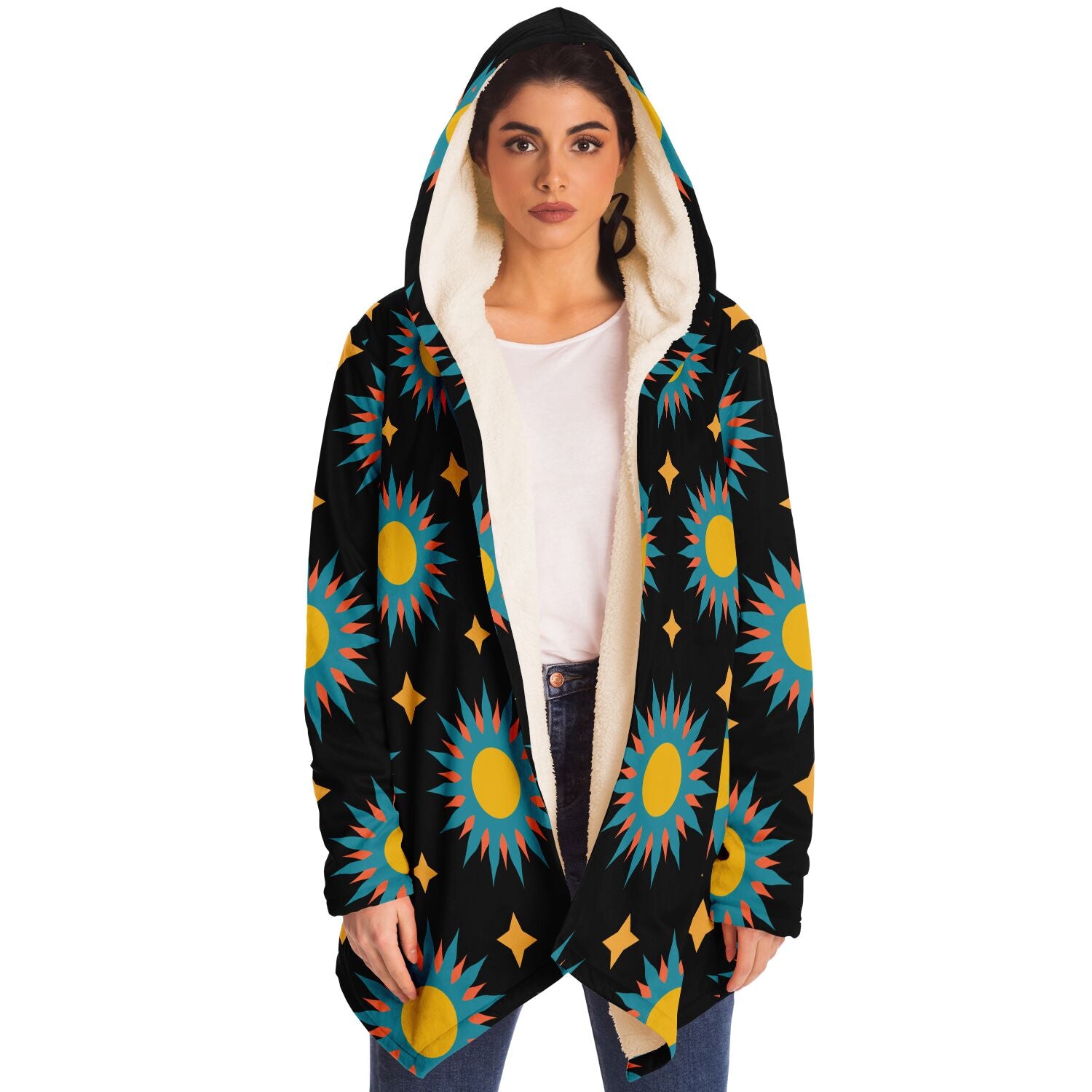 Woman wearing a cozy, hooded, black microfleece cloak with a colorful sun design.