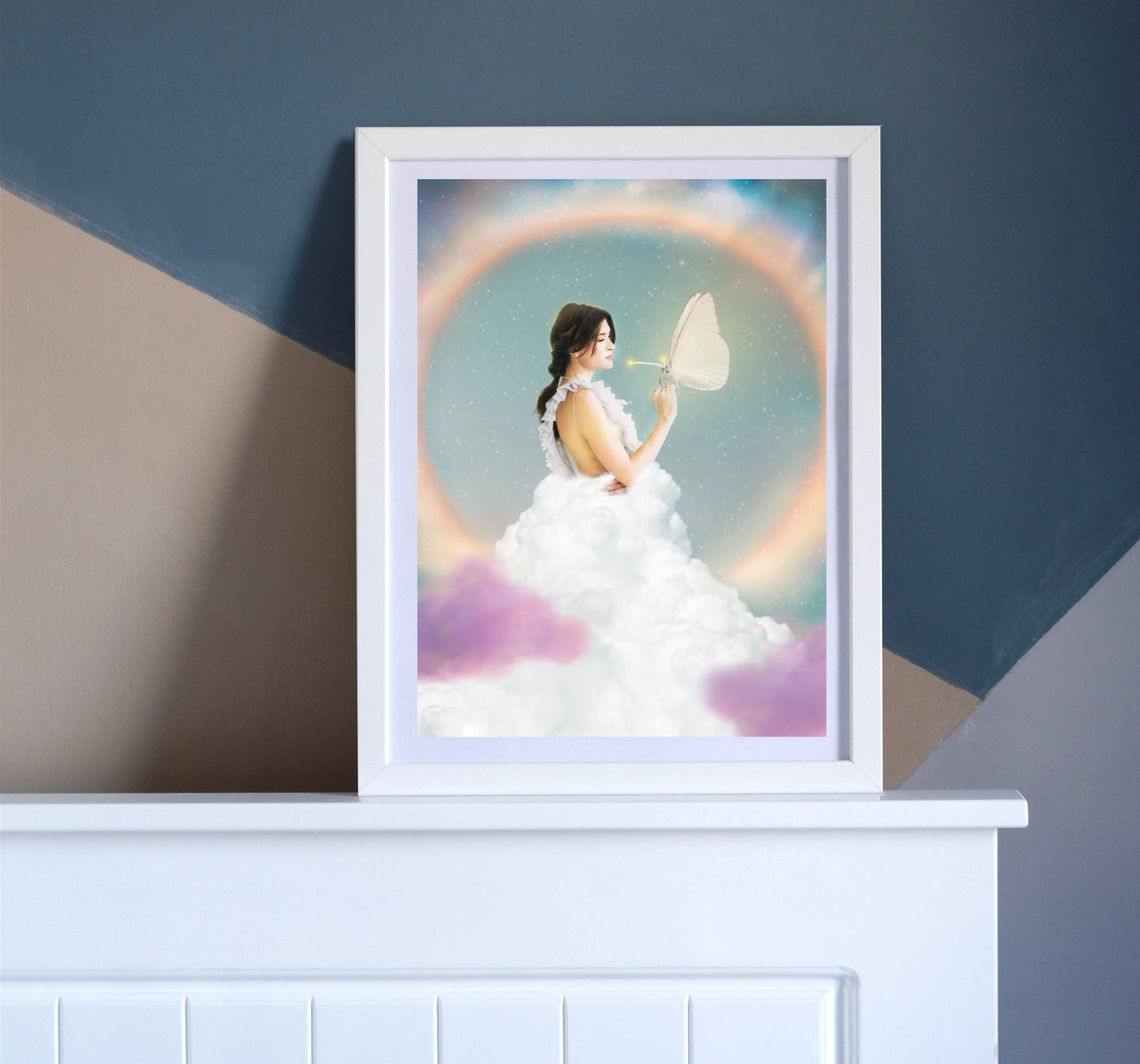 Woman in a white dress holding a butterfly with a colorful, rainbow background.