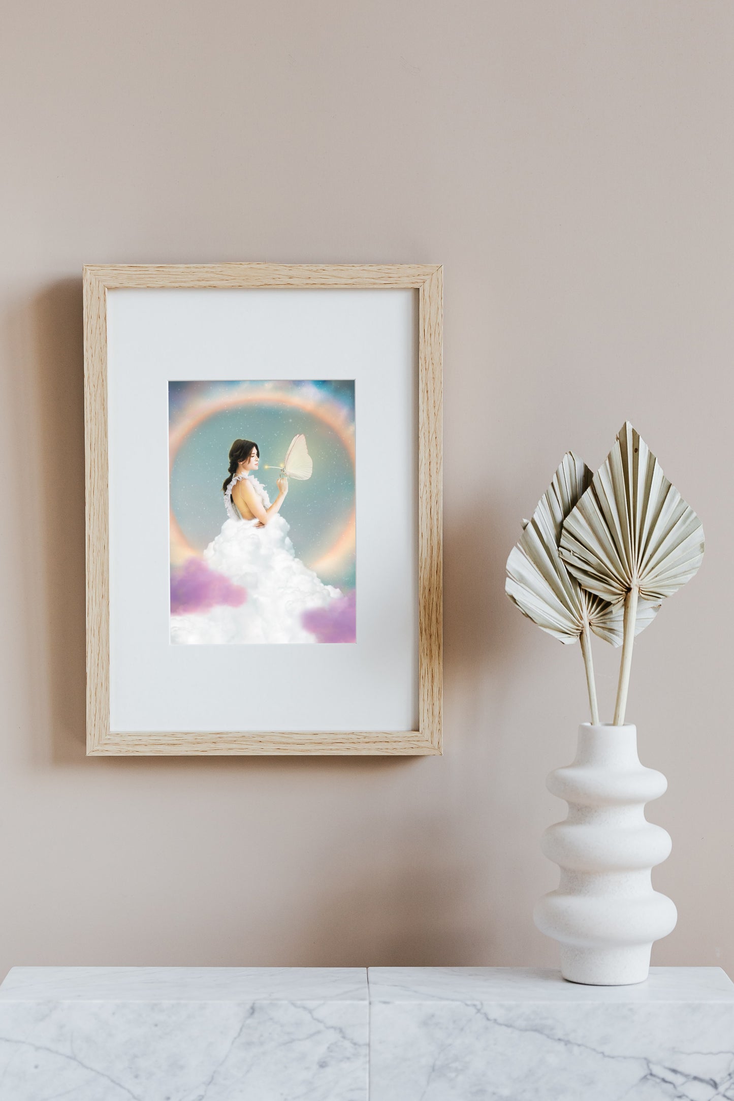 Woman in a white dress holding a butterfly with a colorful, rainbow background.
