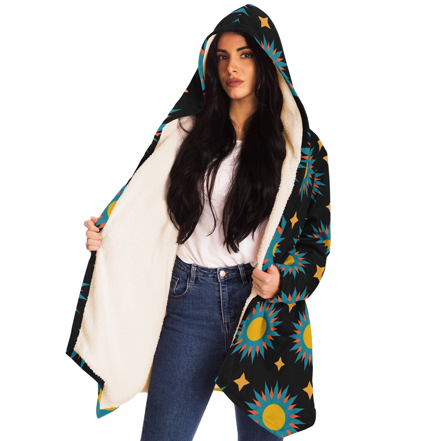 Woman wearing a cozy, hooded, black microfleece cloak with a colorful sun design.