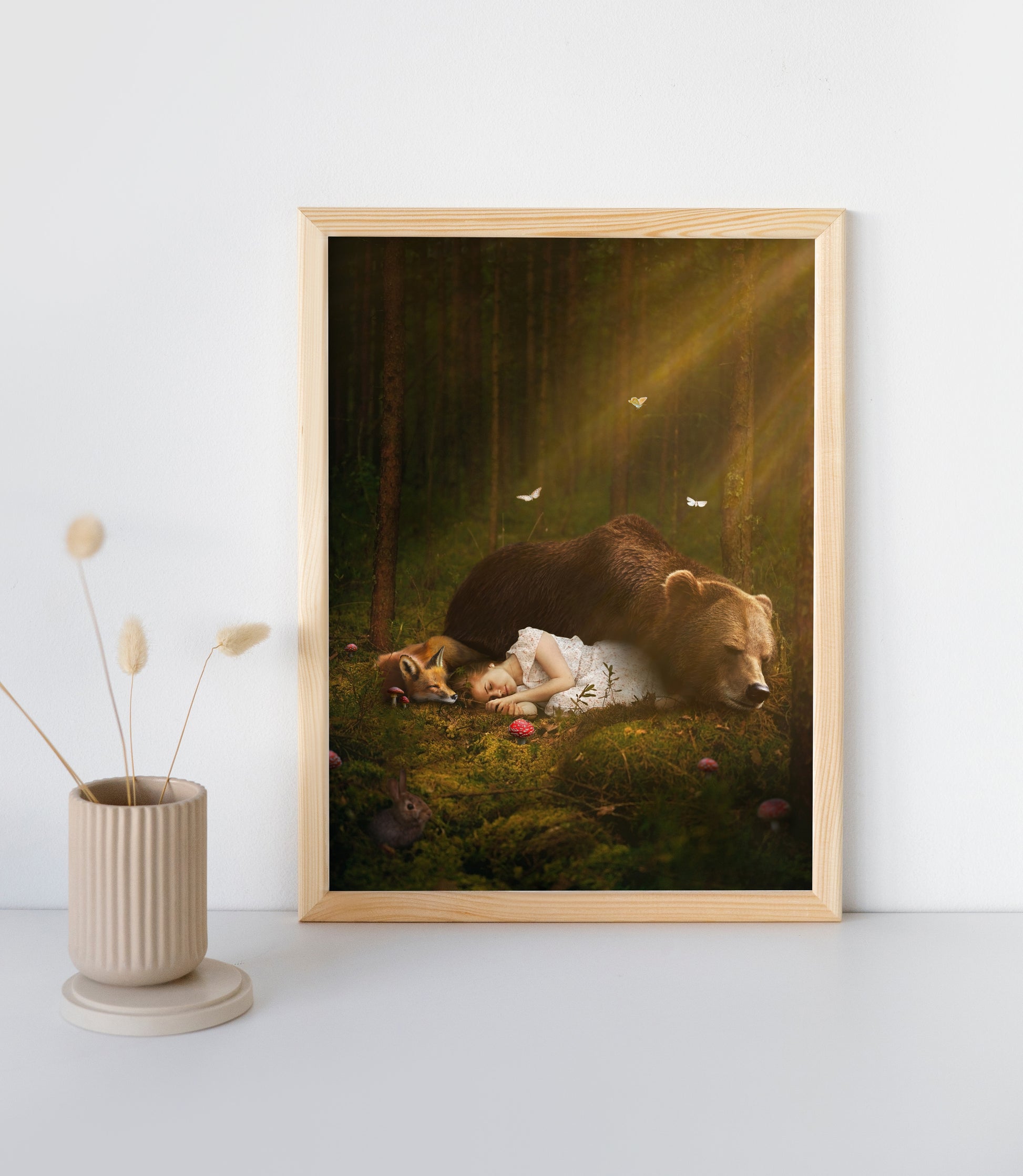 A magical scene of a young girl sleeping on the forest floor with a bear and a fox.