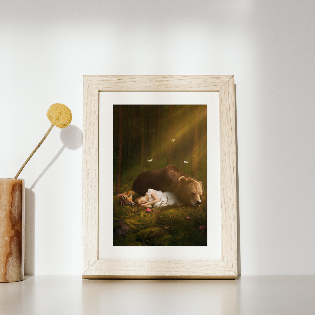 A magical scene of a young girl sleeping on the forest floor with a bear and a fox.