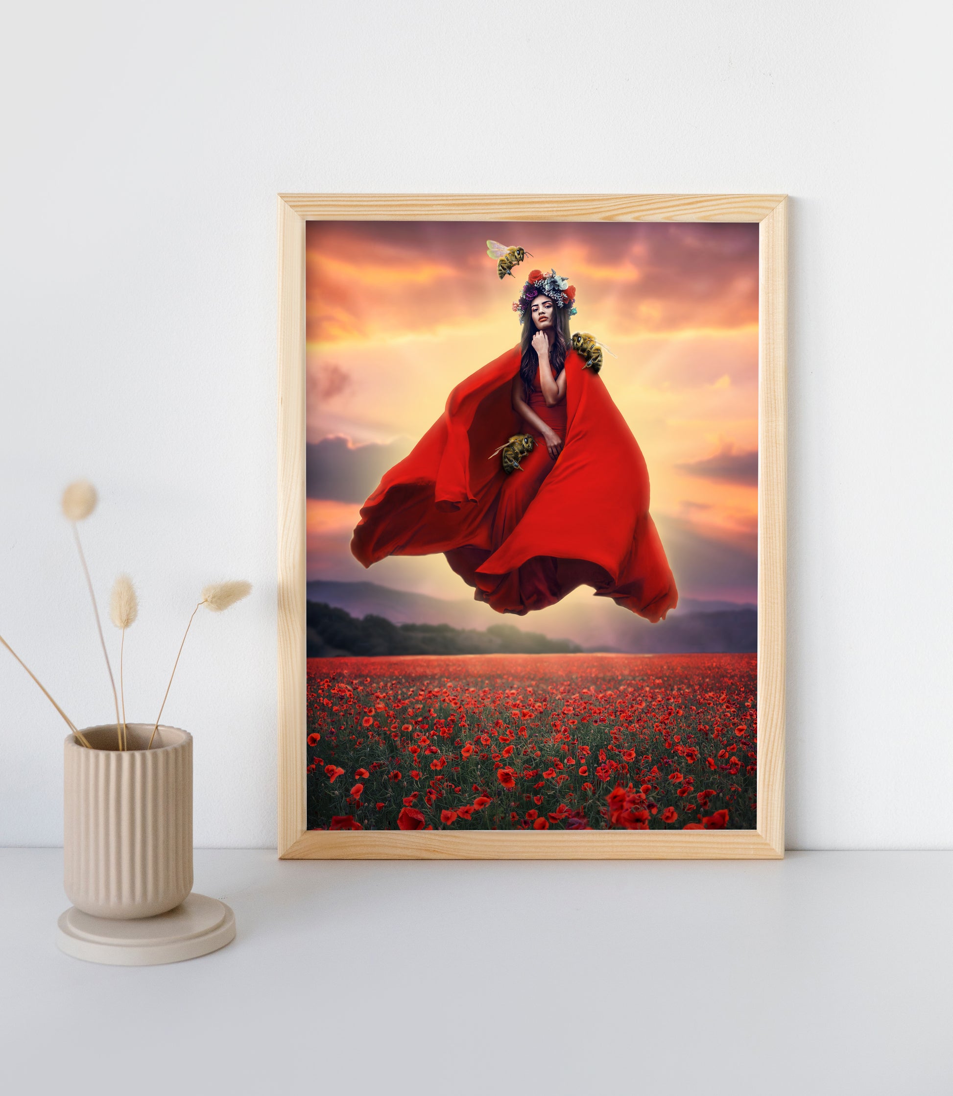 Woman in a red dress and flower crown floating above a field of poppies guarded by her bee companions.