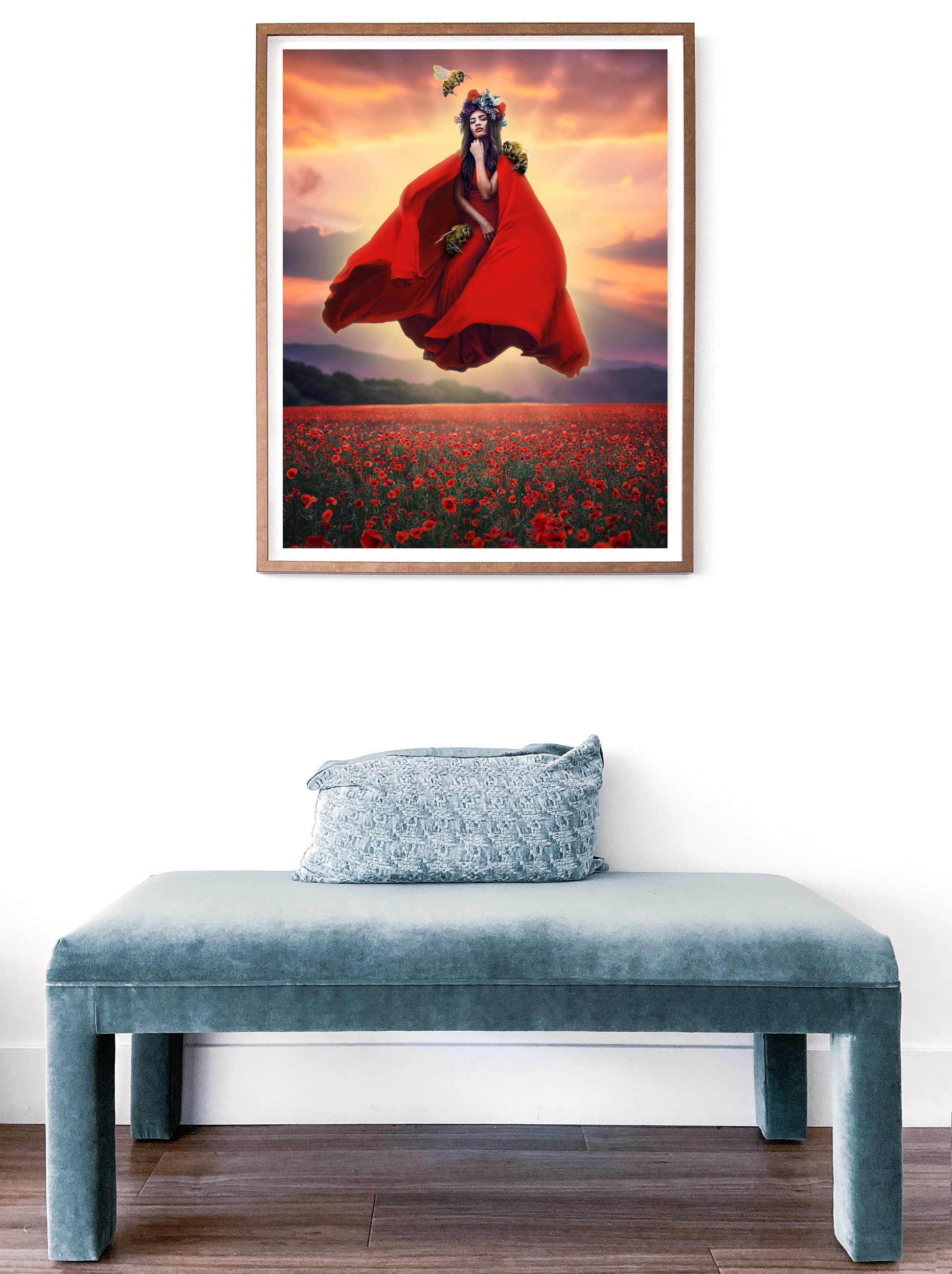 Woman in a red dress and flower crown floating above a field of poppies guarded by her bee companions.
