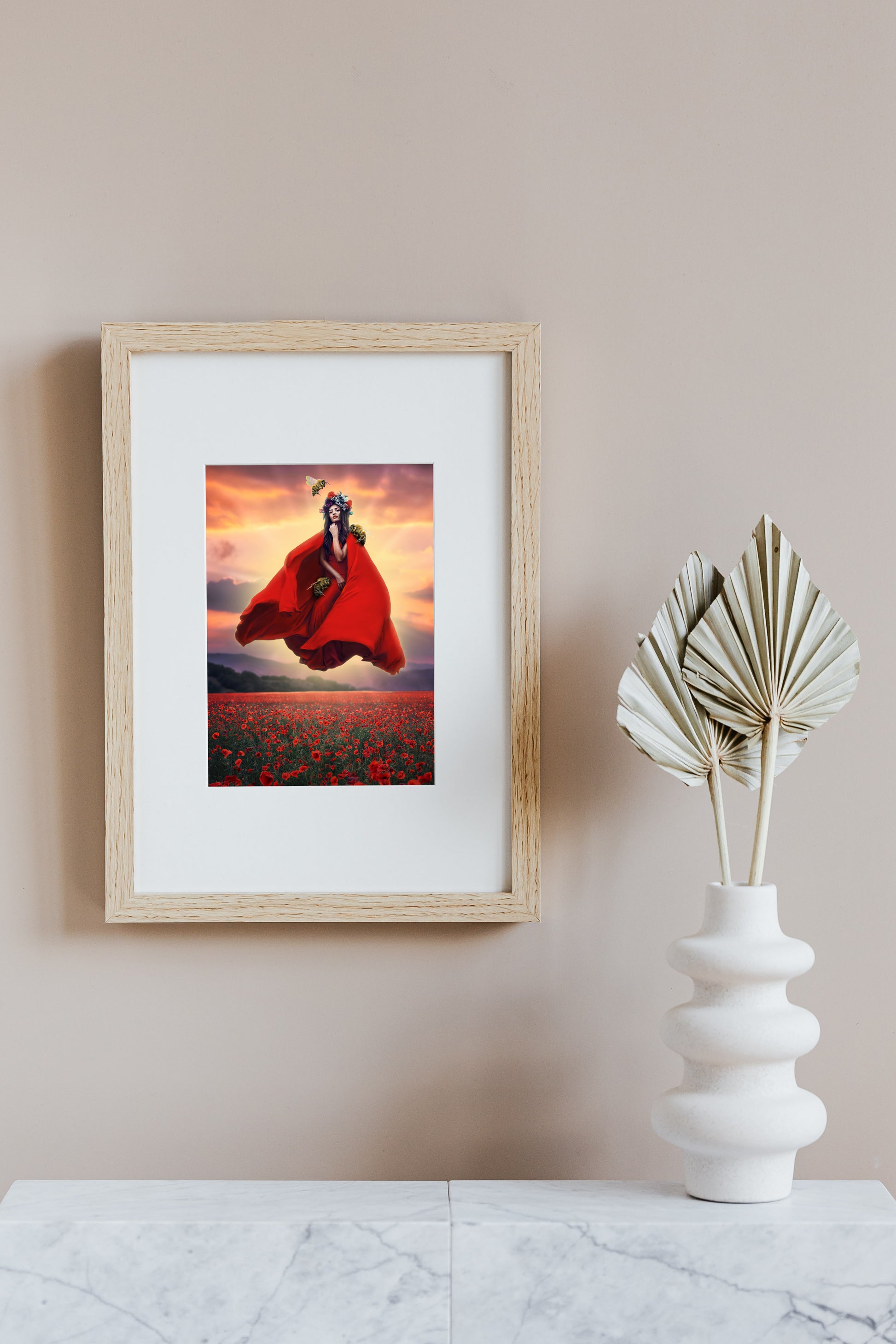 Woman in a red dress and flower crown floating above a field of poppies guarded by her bee companions.