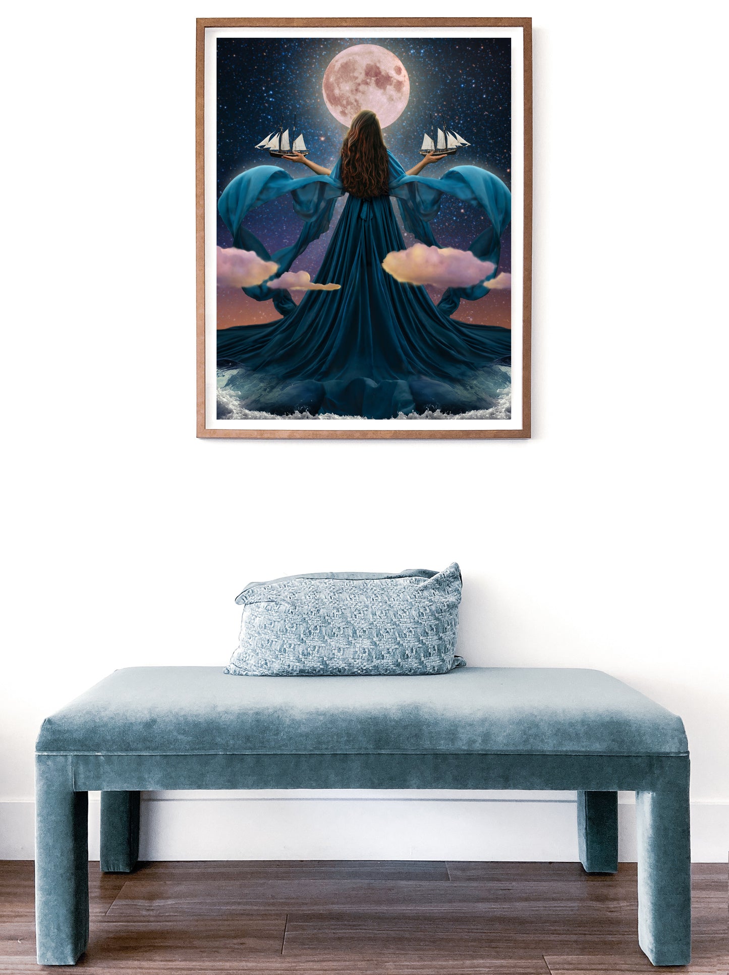 Woman rising from the ocean to stand before the moon with a dress made of water holding two ships amongst the clouds.