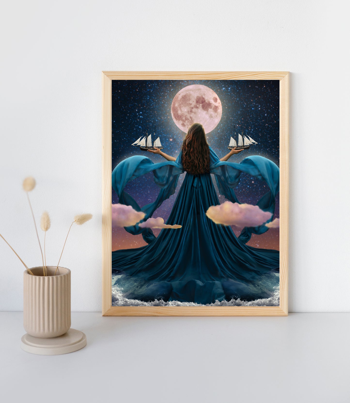 Woman rising from the ocean to stand before the moon with a dress made of water holding two ships amongst the clouds.