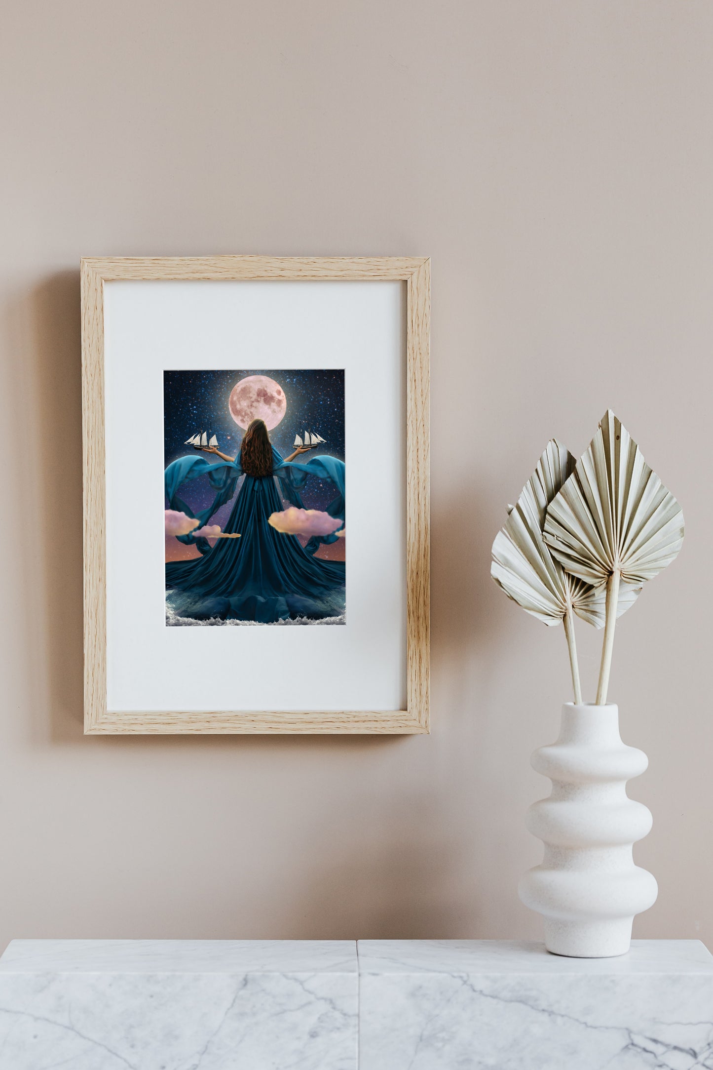 Woman rising from the ocean to stand before the moon with a dress made of water holding two ships amongst the clouds.