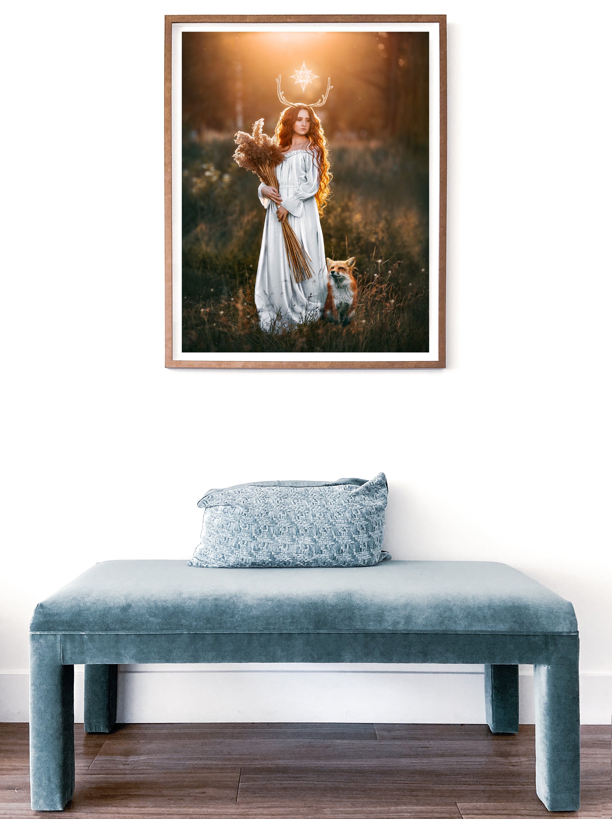 Woman in a white dress with a fox in a field at sunset.