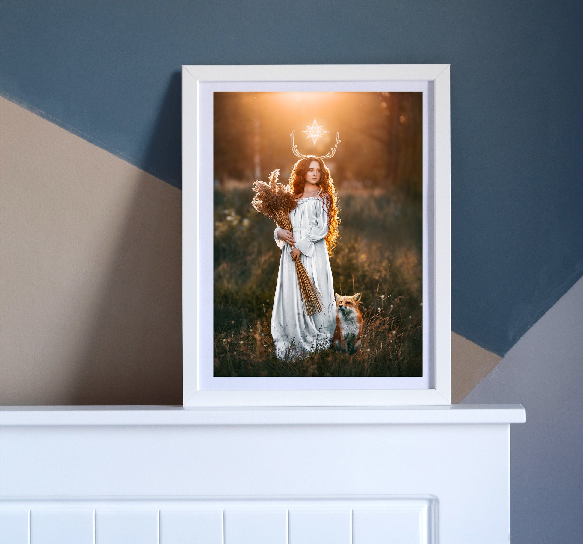 Woman in a white dress with a fox in a field at sunset.