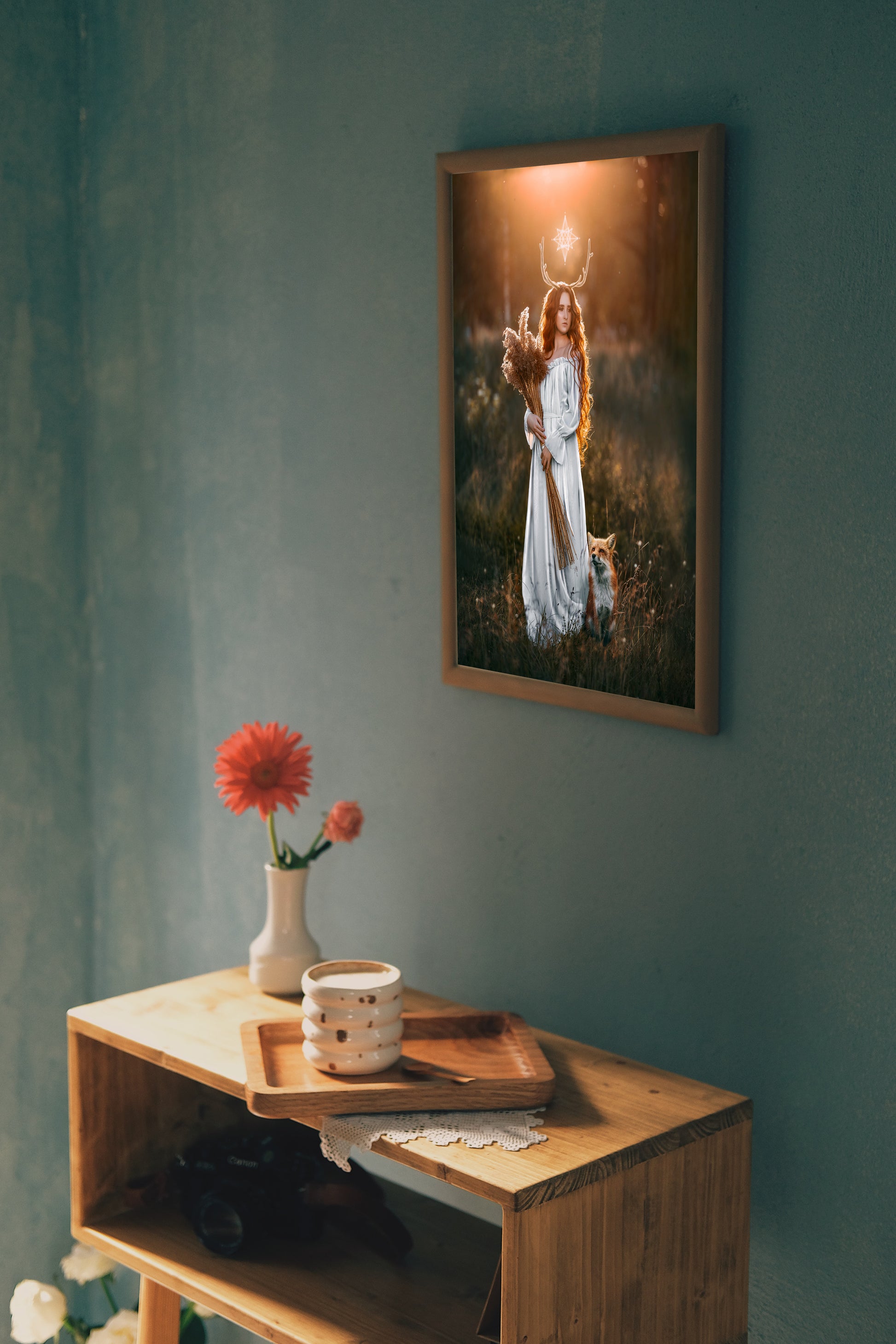Woman in a white dress with a fox in a field at sunset.