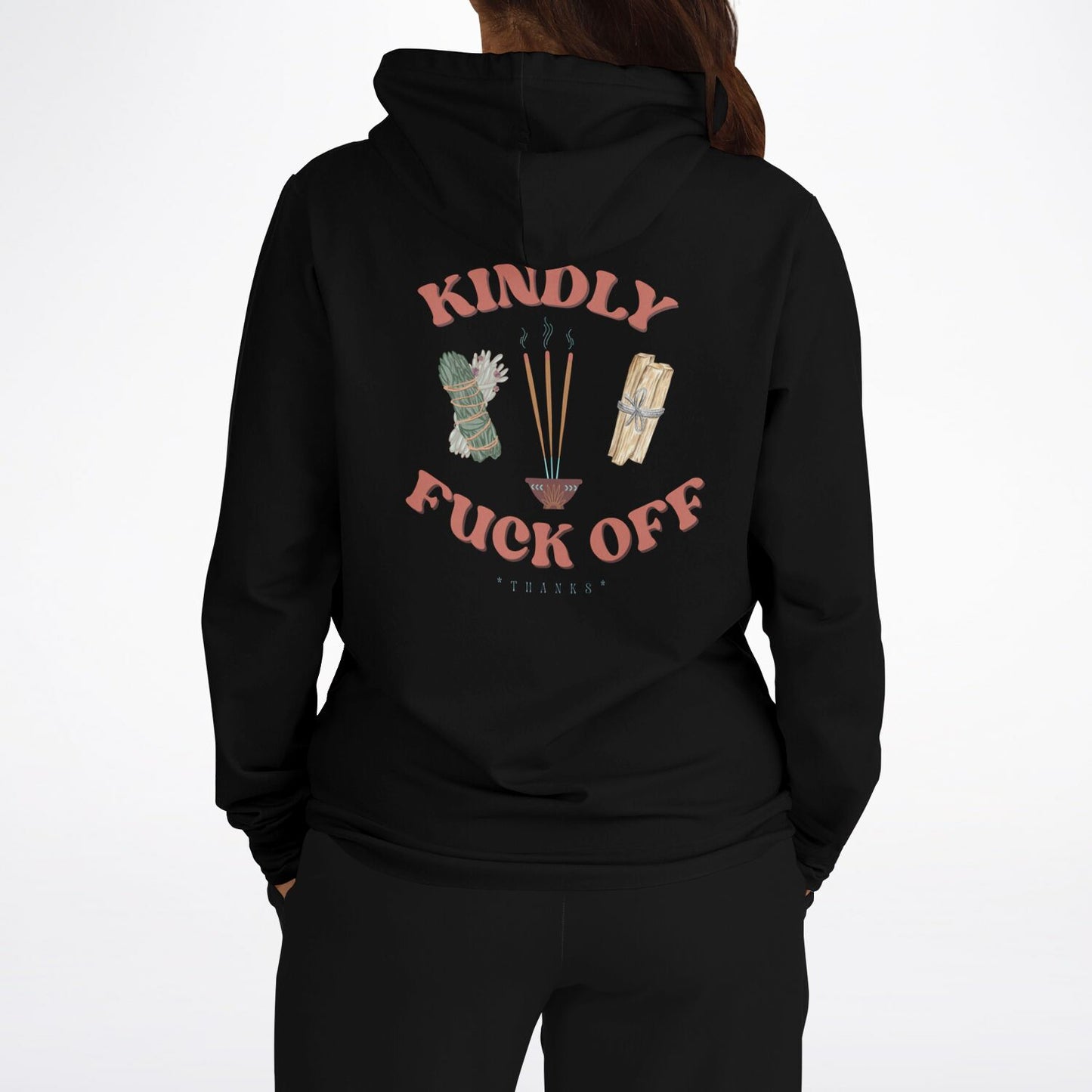 Women wearing a black hoodie that says Kindly Fuck Off with incense, sage, and palo santo graphics on the back.