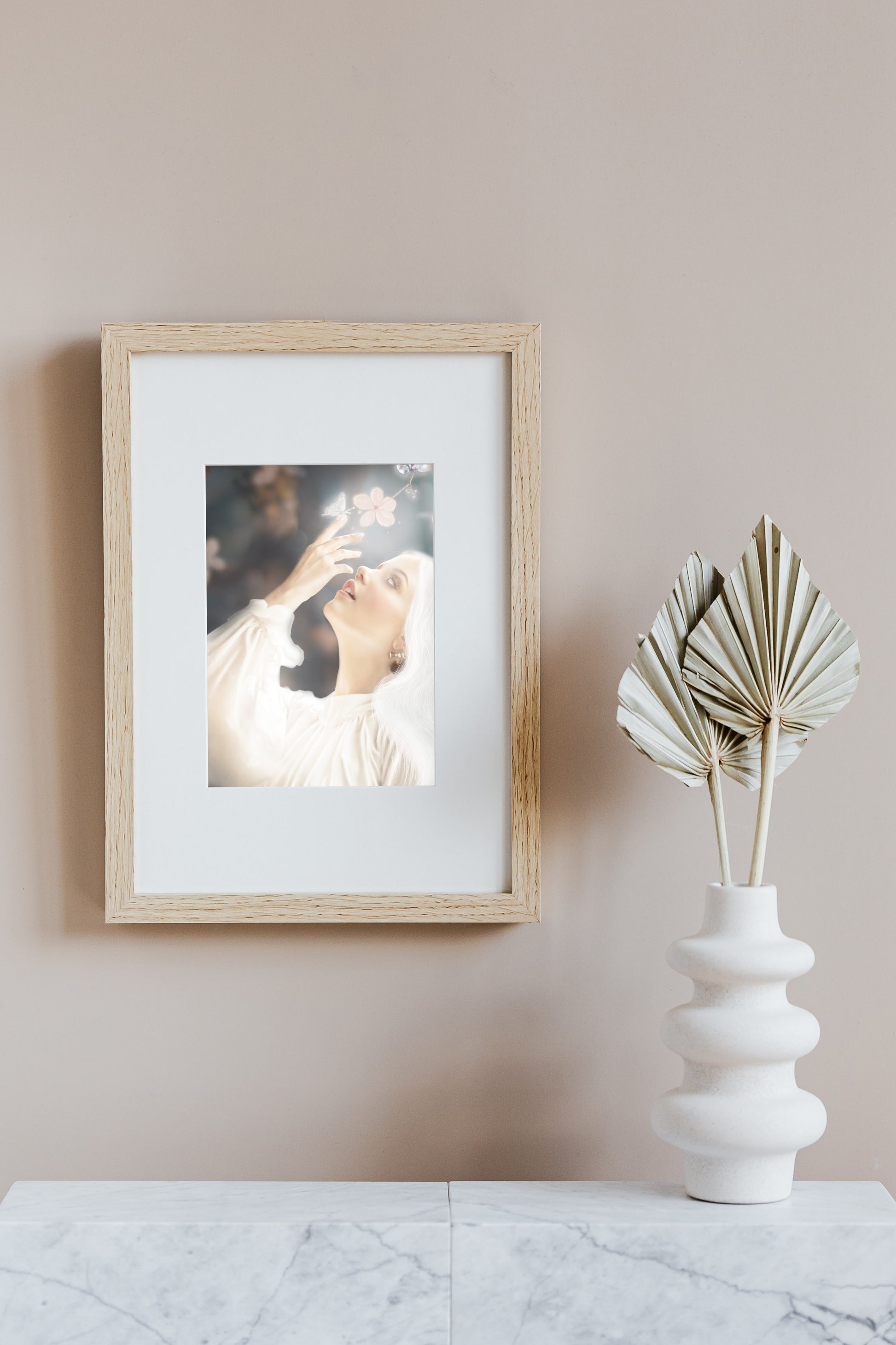 Woman in white reaching towards flowers with a glowing butterfly on her finger.