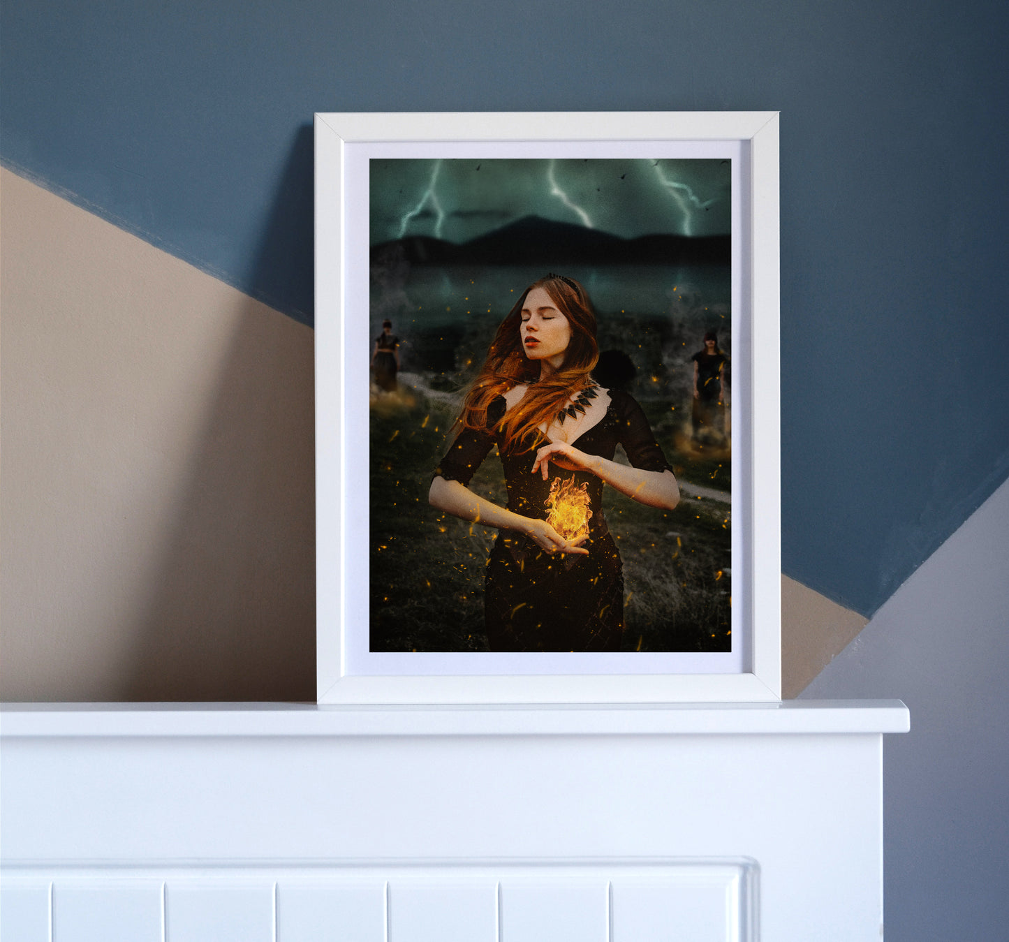 Woman holding a burning flame in her hands with a storm brewing behind her and two women burned at the stake in the background.